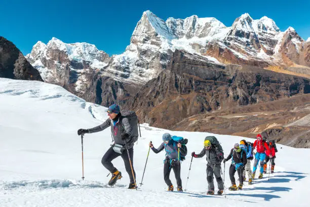 https://media.istockphoto.com/id/649356542/photo/adventurous-people-making-ascent-to-high-mountain-walking-on-glacier.jpg?s=612x612&w=0&k=20&c=AfPRVWzVTEkH8WpWDIiKv0Et7zRKe0UEuM0biLwAQsw=