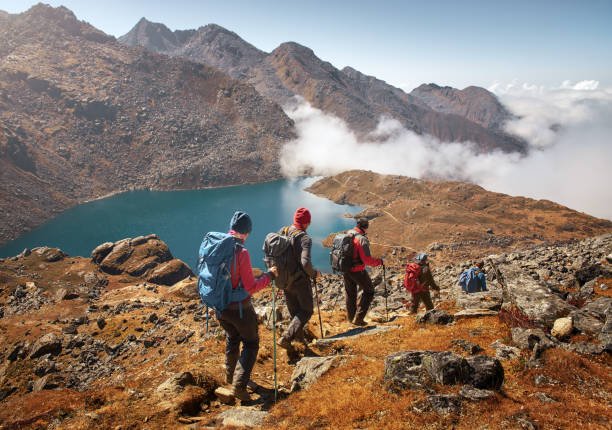 https://media.istockphoto.com/id/907767796/photo/group-tourists-with-backpacks-descends-down-on-mountain-trail-during-hike.jpg?s=612x612&w=0&k=20&c=jTsbXqa8gMDaKHHqiQjwfNWKp-8j2Q6GzVrKBlWjIGg=