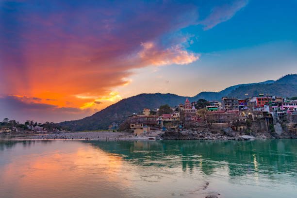 https://media.istockphoto.com/id/845169996/photo/dusk-time-at-rishikesh-holy-town-and-travel-destination-in-india-colorful-sky-and-clouds.jpg?s=612x612&w=0&k=20&c=cNmuXsk2lslW3ZI6UbDJvtgj3XA1zZw_r-K-LL2Je0o=