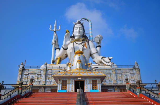 https://media.istockphoto.com/id/1455411037/photo/statue-of-lord-shiva-in-char-dham-temple-complex-in-namchi.jpg?s=612x612&w=0&k=20&c=ry82YhNeHejK7Gw4-8In2l2Lv92y9RSCf8_KxJ-YQOY=